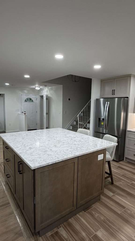Kitchen island with quartz countertop by Nuvista Designs General Contractors in Bergen County, NJ