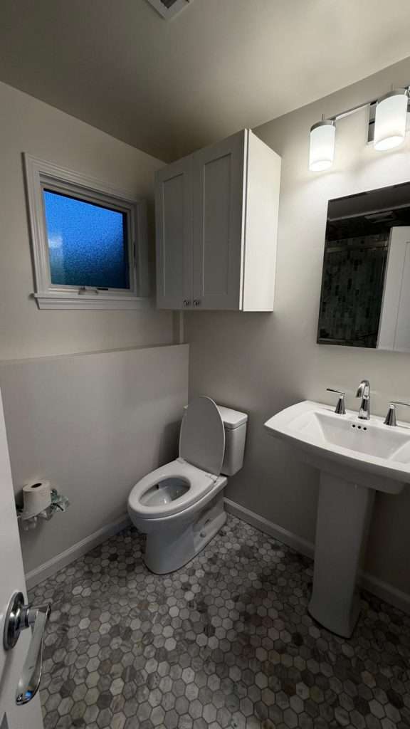 Bathroom remodel with pedestal sink and tile by Nuvista Designs General Contractors in Bergen County, NJ