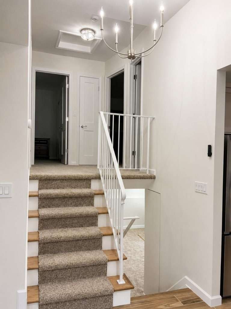 Renovated staircase and carpeted entryway by Nuvista Designs General Contractors in Bergen County, NJ