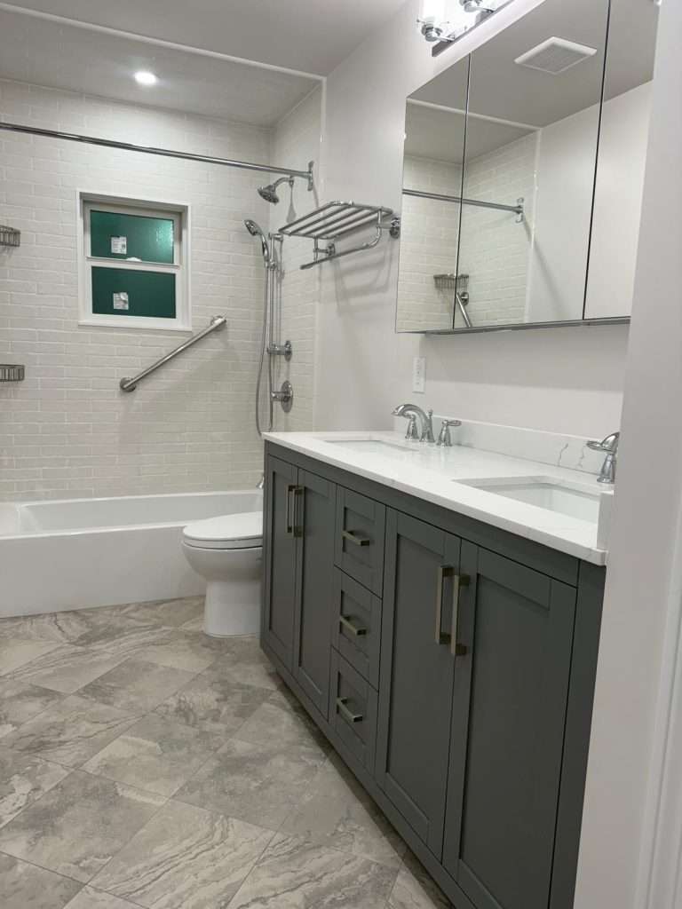 Bathroom remodel with double vanity and tub by Nuvista Designs General Contractors in Bergen County, NJ