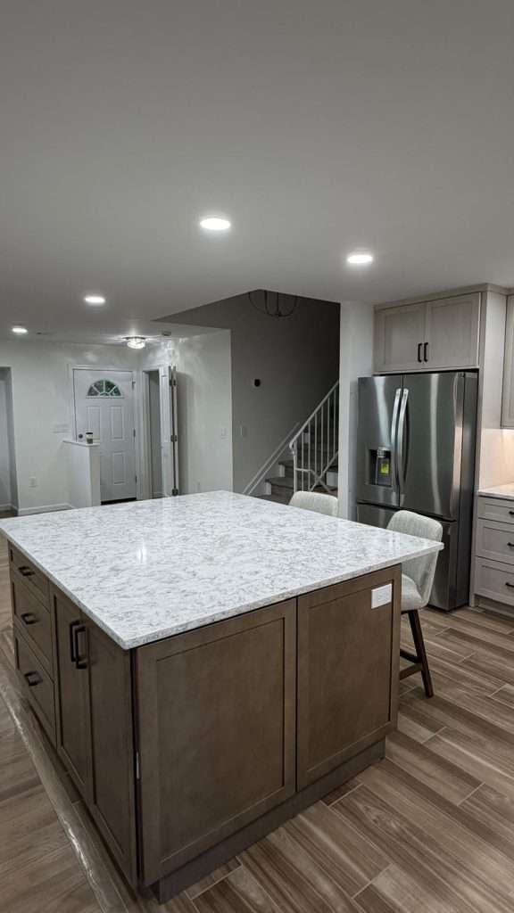 Kitchen remodel with island and quartz counters by Nuvista Designs General Contractors in Bergen County, NJ