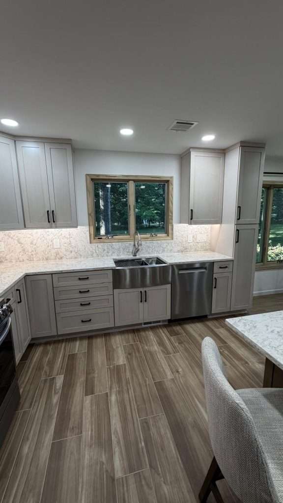 Kitchen remodel with gray cabinetry and island by Nuvista Designs General Contractors in Bergen County, NJ