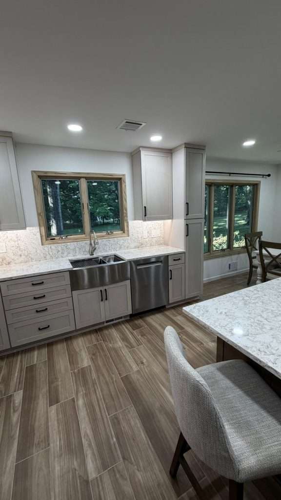 Remodeled kitchen with island and stainless appliances by Nuvista Designs General Contractors in Bergen County, NJ